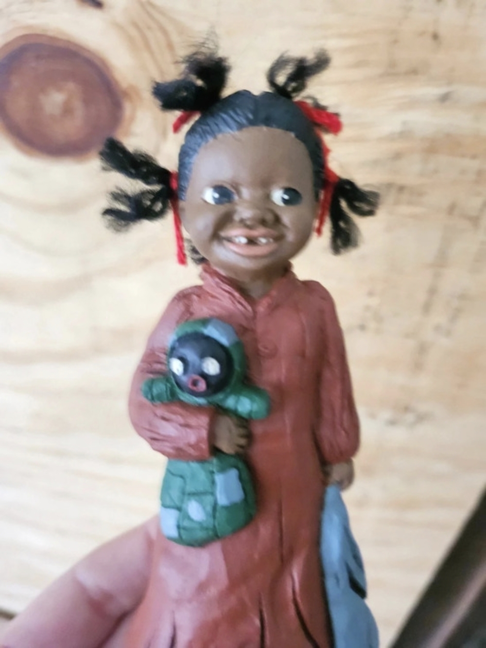 Doll with Green Toy Accessory